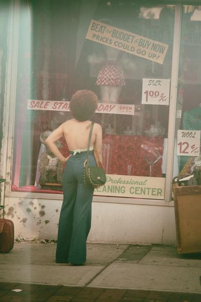 Person Standing Infront Of A Display Window.