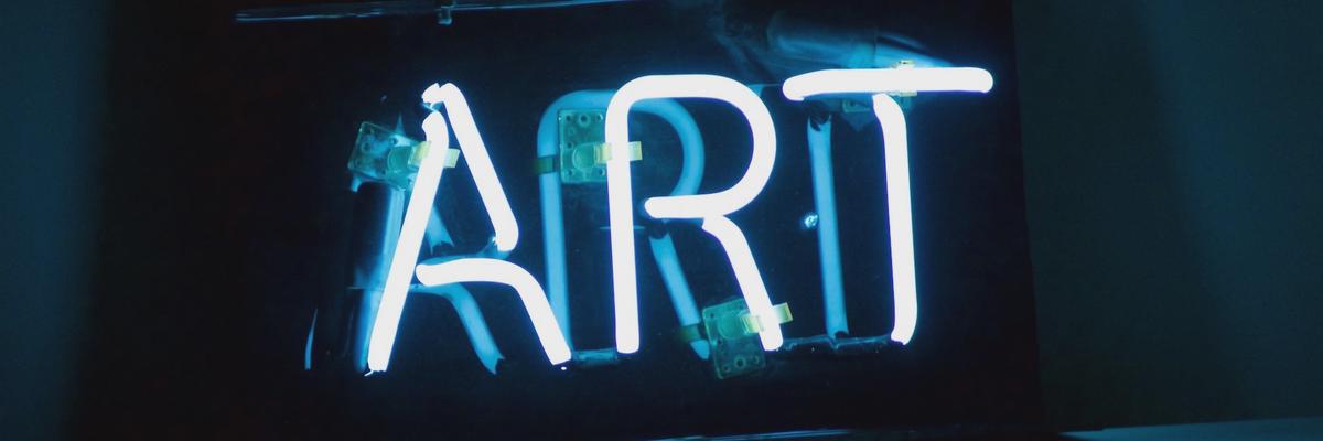 Neon sign that spells the word Art.